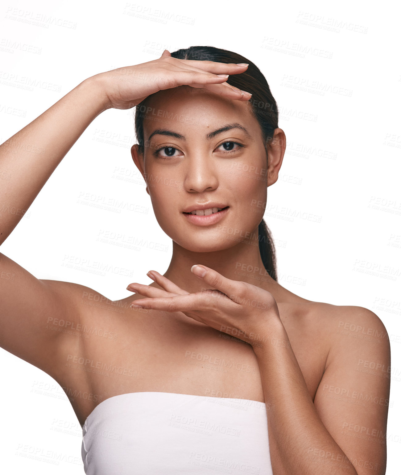 Buy stock photo Shot of a beautiful young woman posing against a white background