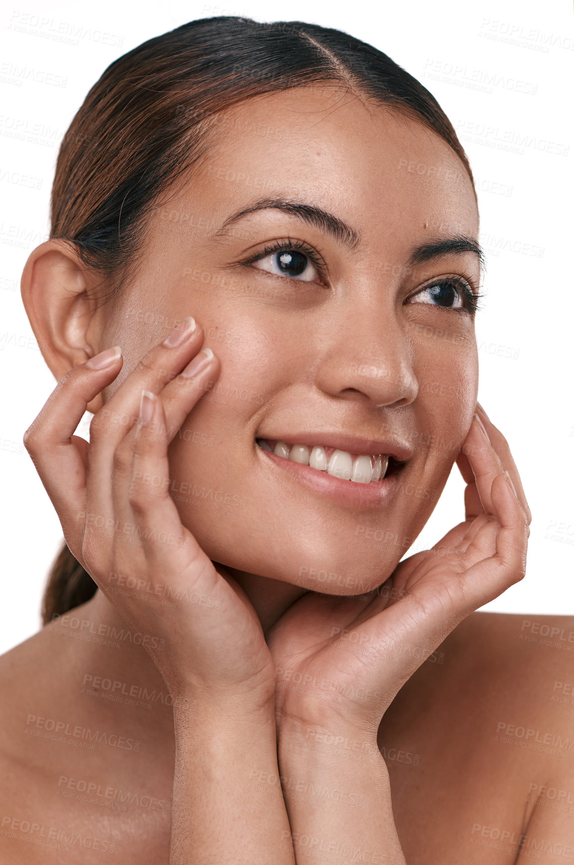 Buy stock photo Shot of a beautiful young woman touching her face while standing against a white background