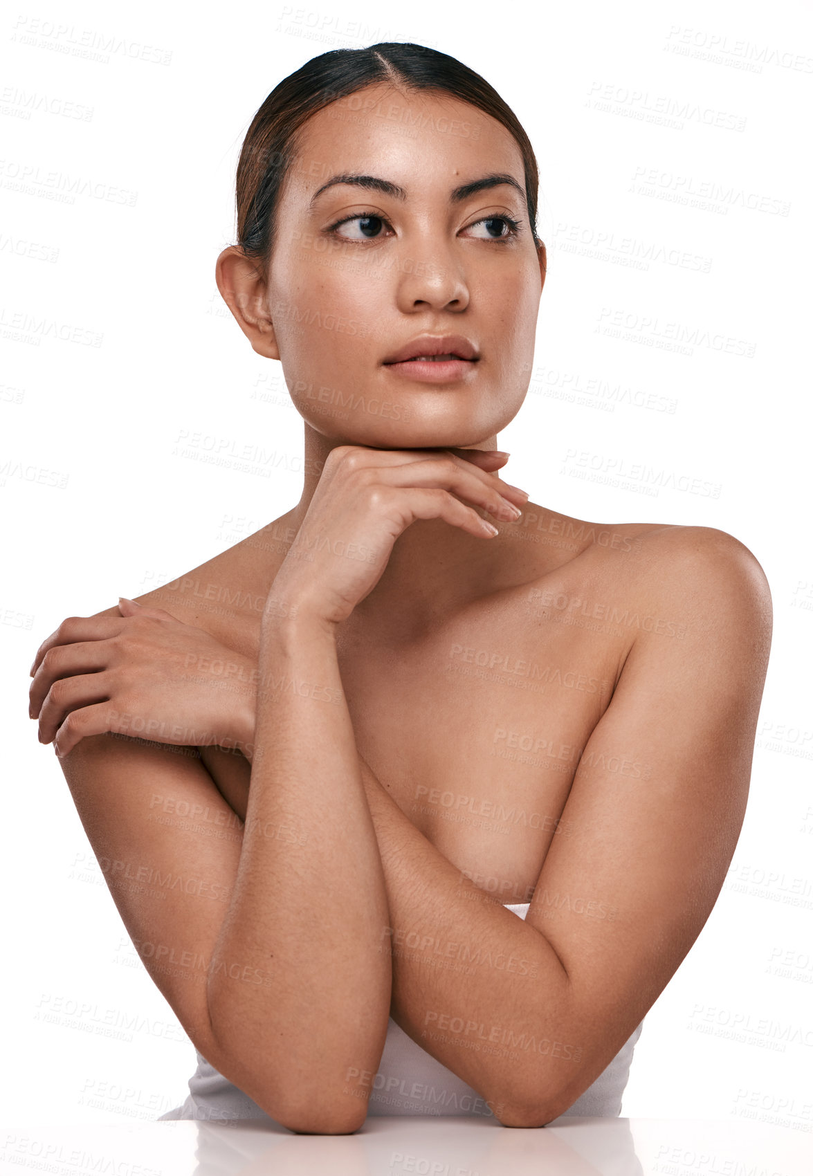 Buy stock photo Shot of a beautiful young woman posing against a white background