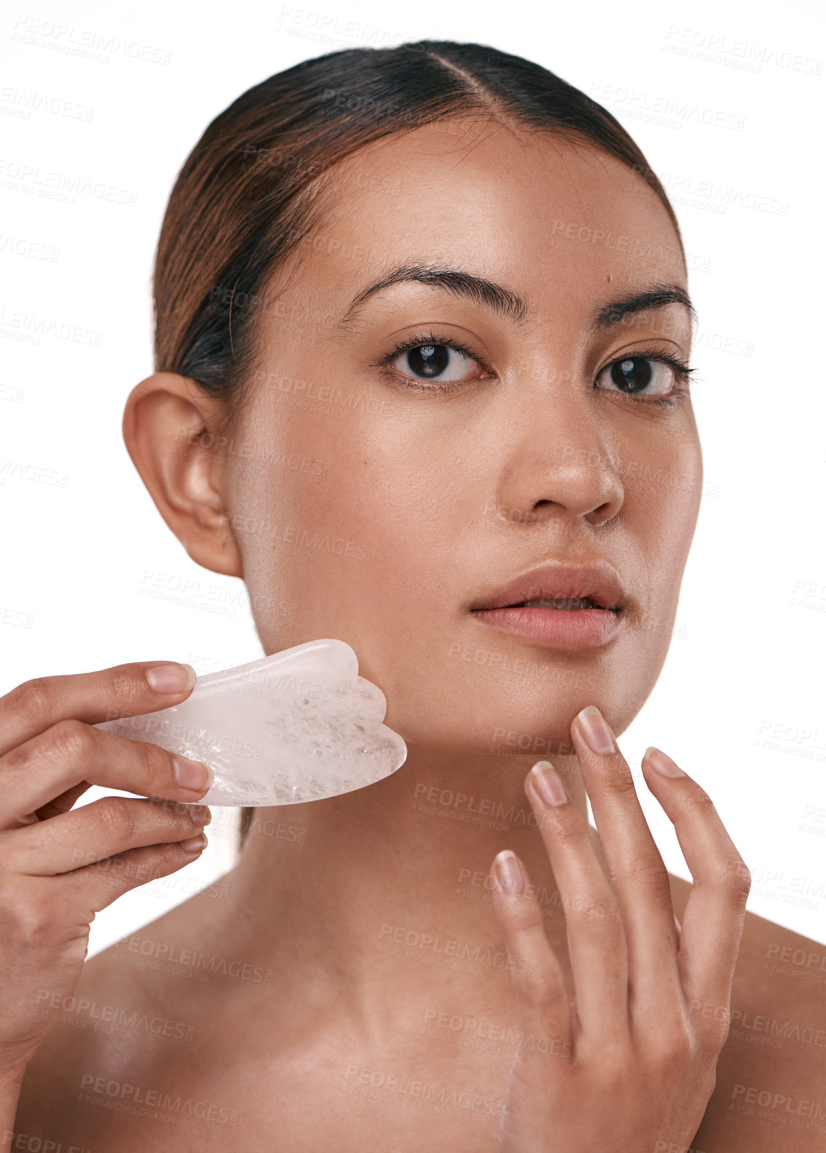 Buy stock photo Portrait, woman and skincare in studio with gua sha, massage or circulation benefits for wellness. Person, cosmetic tool or beauty with dermatology, lymphatic drainage or product on white background.