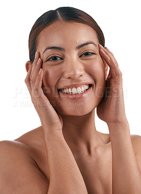 Buy stock photo Shot of a beautiful young woman touching her face while standing against a white background