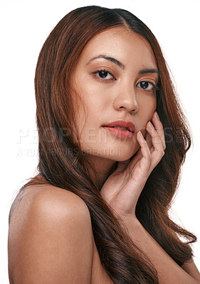 Buy stock photo Studio shot of a beautiful young woman with long brown hair against a white background