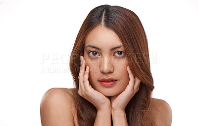 Buy stock photo Studio shot of a beautiful young woman with long brown hair against a white background