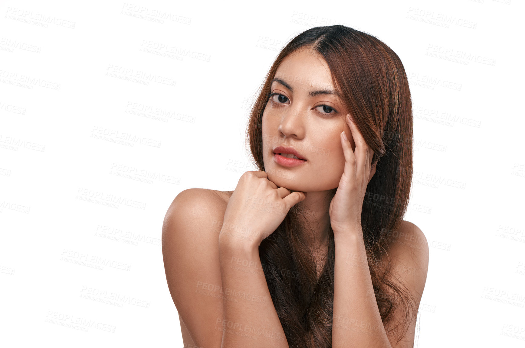 Buy stock photo Studio shot of a beautiful young woman with long brown hair against a white background