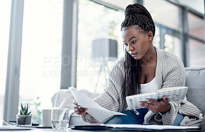 Buy stock photo Planning finance, budget and savings with paperwork, bank document and investment report in home living room. Serious, thinking woman reading student loan information and calculating financial future