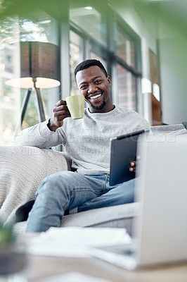 Buy stock photo Portrait, coffee and tablet with a black man on a sofa, sitting in the living room of his home to relax. Smile, technology and internet with a happy person relaxing in a house to browse social media