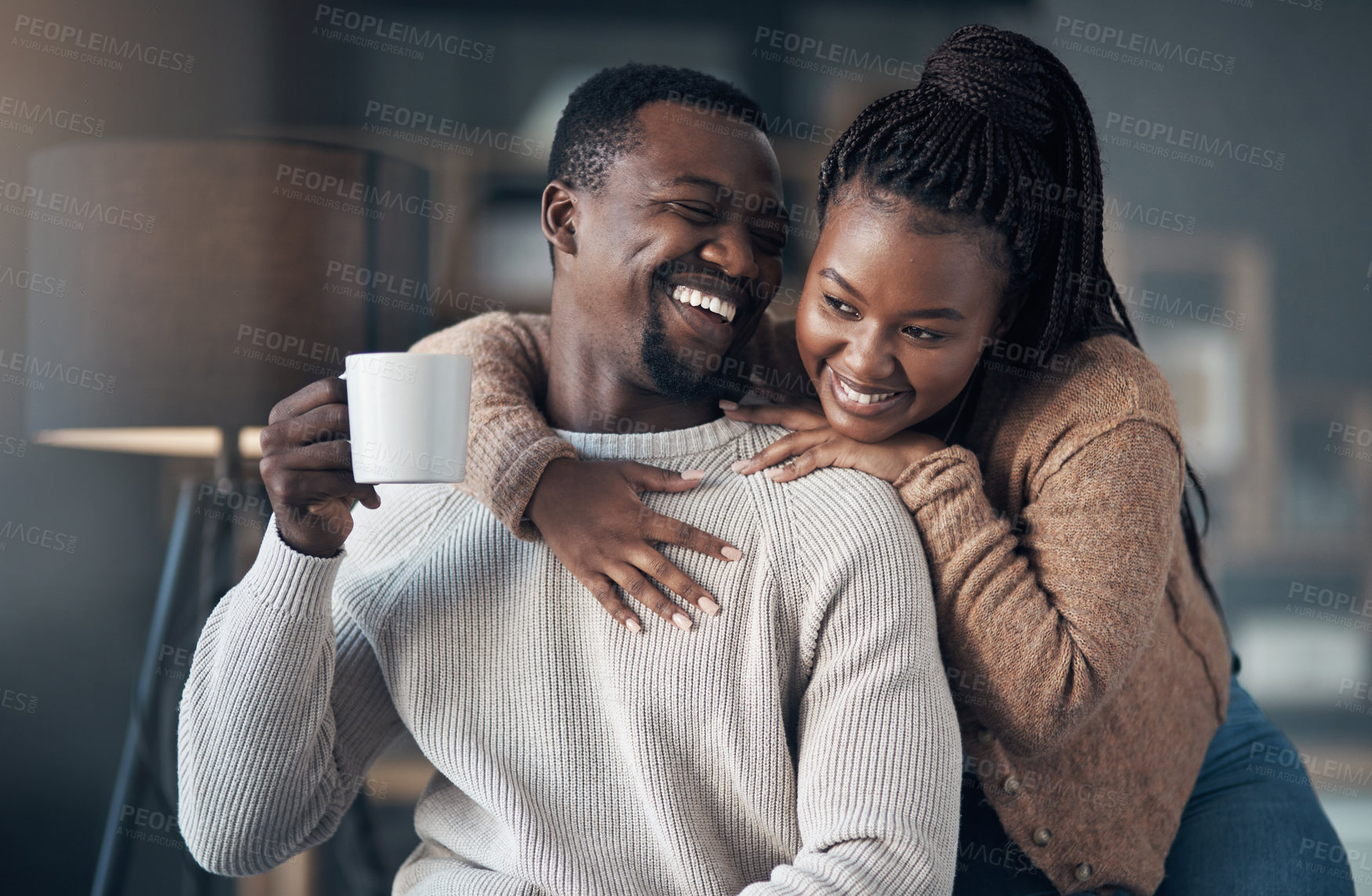 Buy stock photo Cropped shot of an affectionate young couple spending a relaxing day at home together