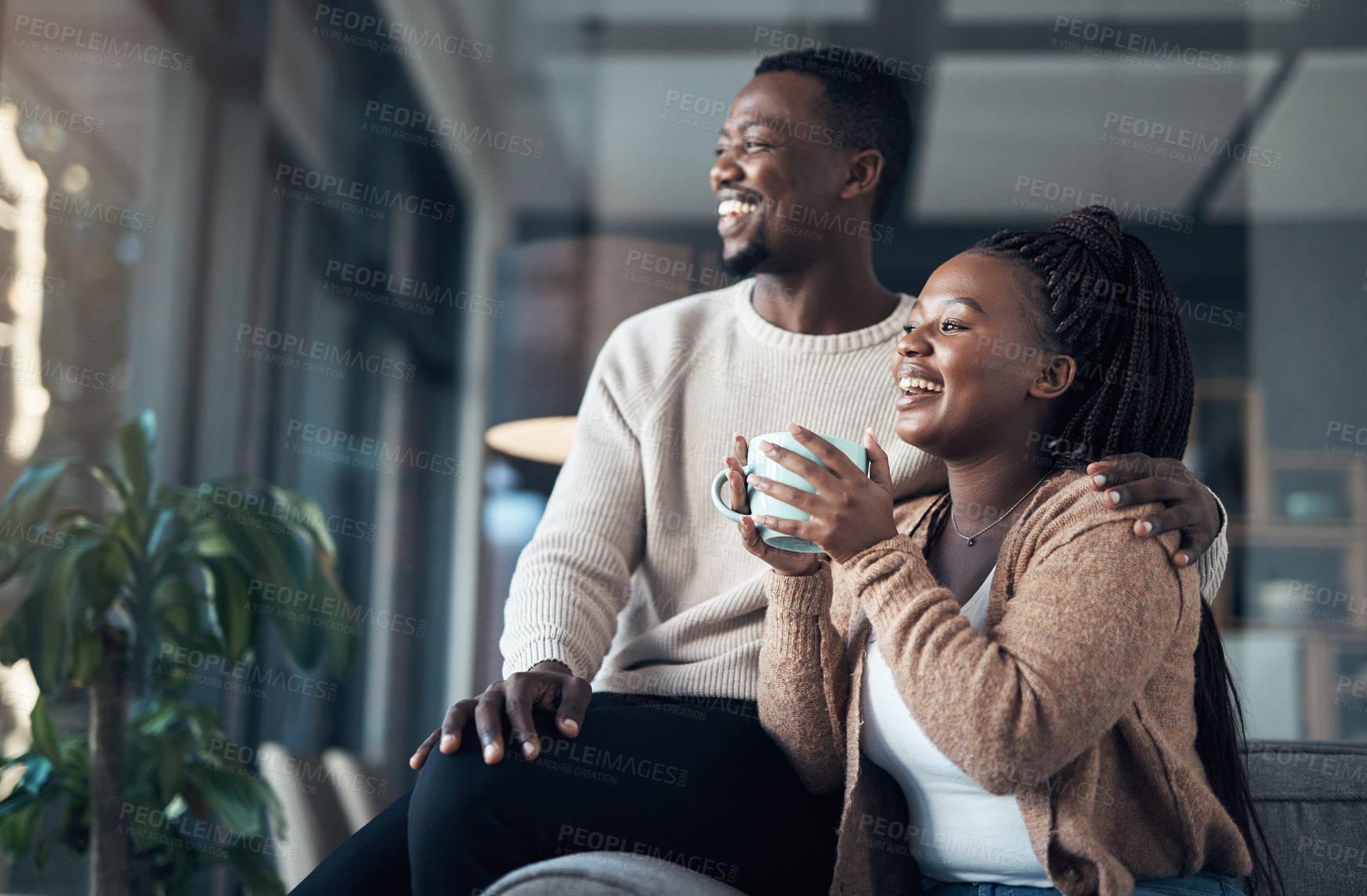 Buy stock photo Cropped shot of an affectionate young couple spending a relaxing day at home together