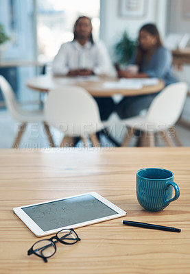 Buy stock photo Closeup shot of a digital tablet and other items on a table in an office