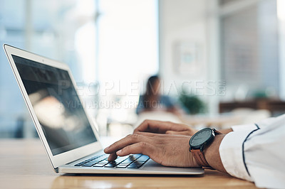 Buy stock photo Closeup shot of an unrecognisable businessman using a laptop in an office