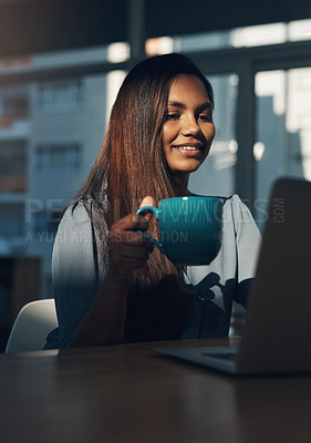 Buy stock photo Shot of a young businesswoman using a laptop in an office.