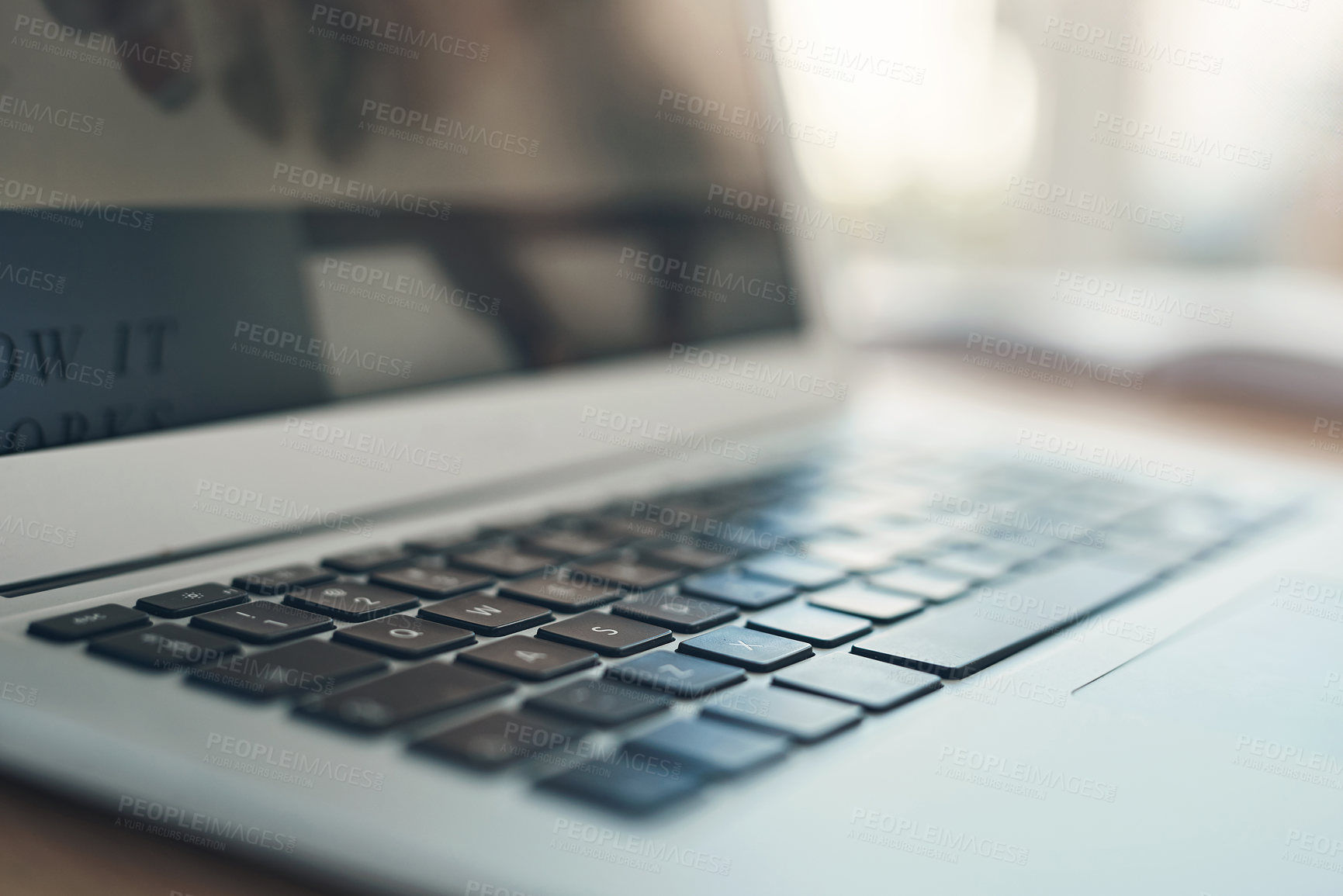 Buy stock photo Still life shot of a laptop on a table in an office