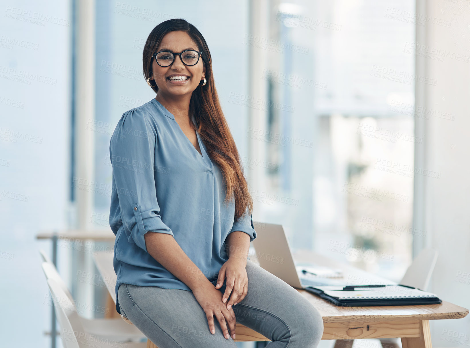 Buy stock photo Portrait of a confident young businesswoman in an office