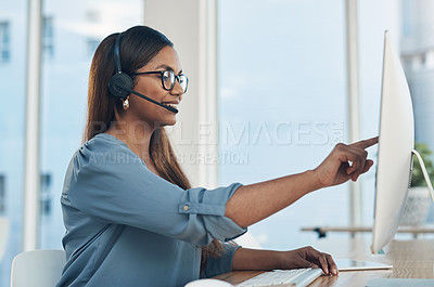 Buy stock photo Woman, computer and headset in call center for customer support, telemarketing and contact with guide. Agent, pointing and tech in agency with friendly service, CRM and professional virtual assistant