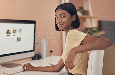 Buy stock photo Portrait of a young woman using a computer while working from home