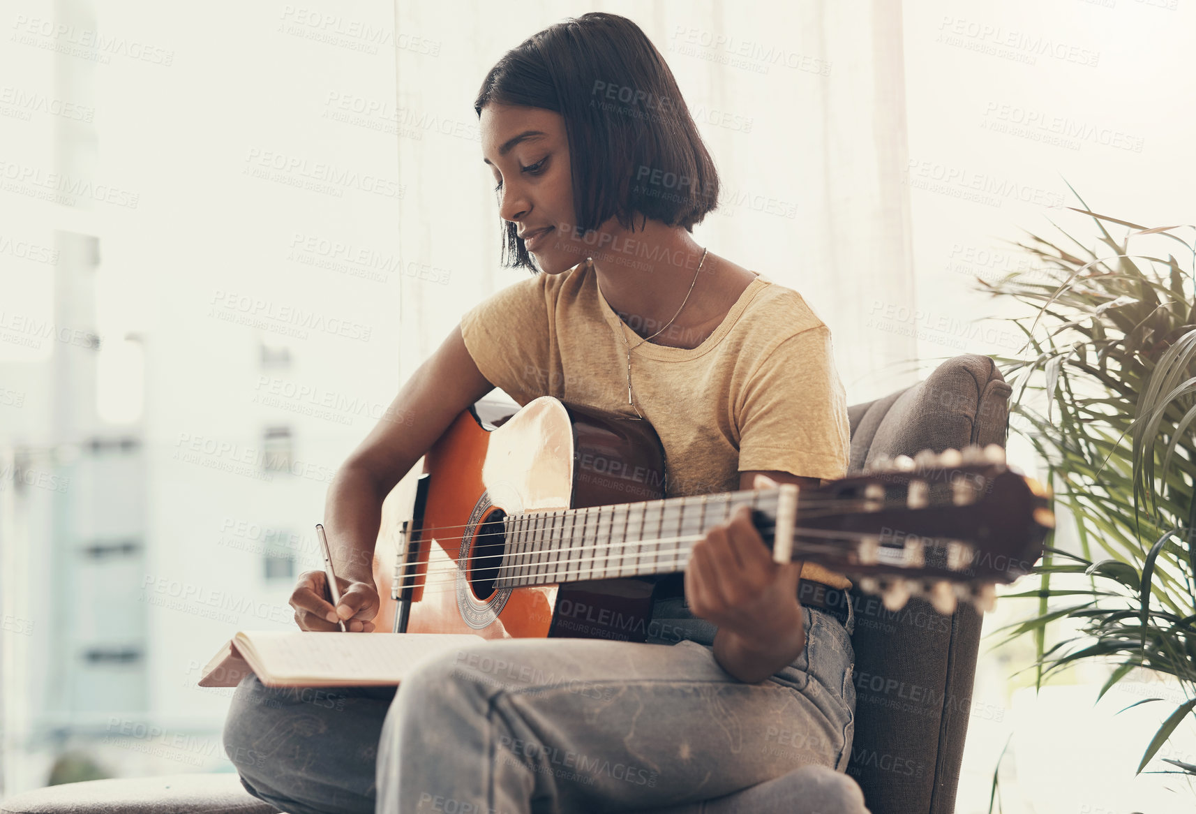 Buy stock photo Woman, guitar and writing music in home for audio production, song composition and practice for performance. Musician, artist or planning notes for track recording, creative lyrics or record producer