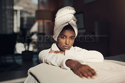 Buy stock photo Portrait of a young woman relaxing on her bed while going through her beauty routine at home
