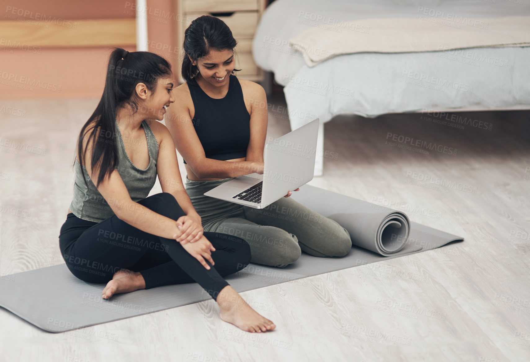 Buy stock photo Women, laptop and exercise together at home with happiness, health and wellness. Indian sisters or female friends in a lounge for online class, yoga website or fitness workout video with a partner