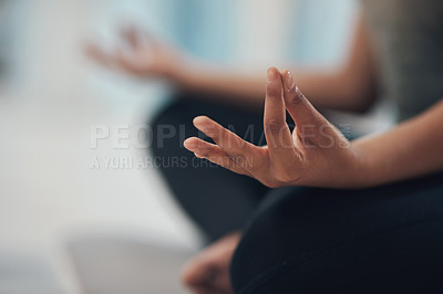 Buy stock photo Cropped shot of an unrecognisable woman meditating in the lotus position