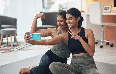 Buy stock photo Exercise, peace sign and selfie of women together at home for social media memory or post. Indian sisters or female friends with a photo for influencer update, fitness motivation or muscle results