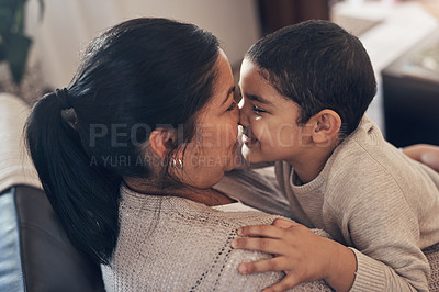 Buy stock photo Shot of an adorable little boy spending quality time with his mother at home