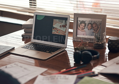 Buy stock photo Shot of a laptop and various other school related items on a desk at home