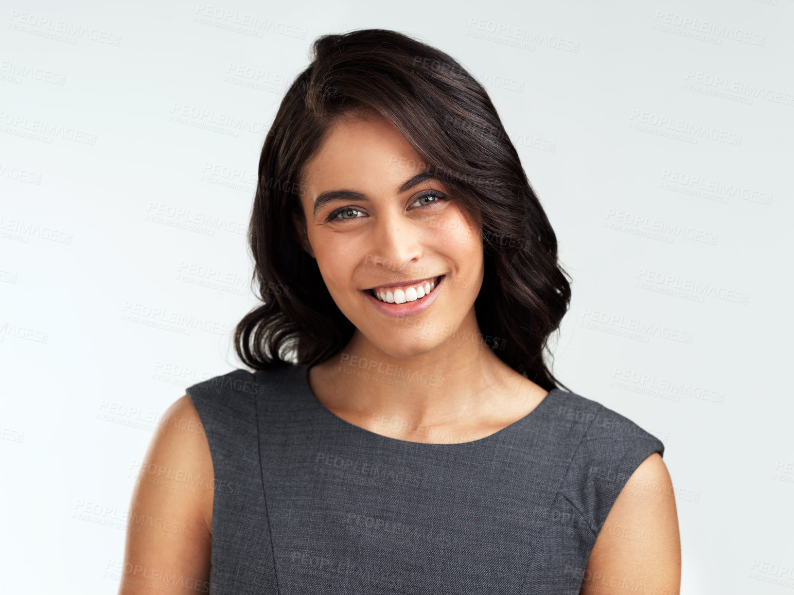 Buy stock photo Shot of a beautiful young woman posing against a white background