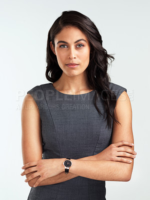 Buy stock photo Shot of a beautiful young woman posing against a white background