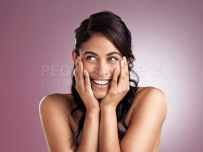 Buy stock photo Shot of a beautiful young woman pondering with her hands rested her chin and face against a pink background