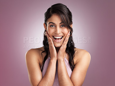 Buy stock photo Shot of a beautiful young cheerful woman  with her hands rested on face against a pink background
