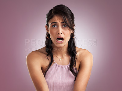 Buy stock photo Shot of a beautiful young woman looking shocked against a pink background