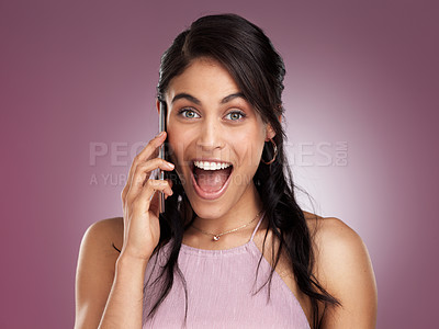 Buy stock photo Shot of a beautiful young woman looking surprised while talking on a mobile phone against a pink background