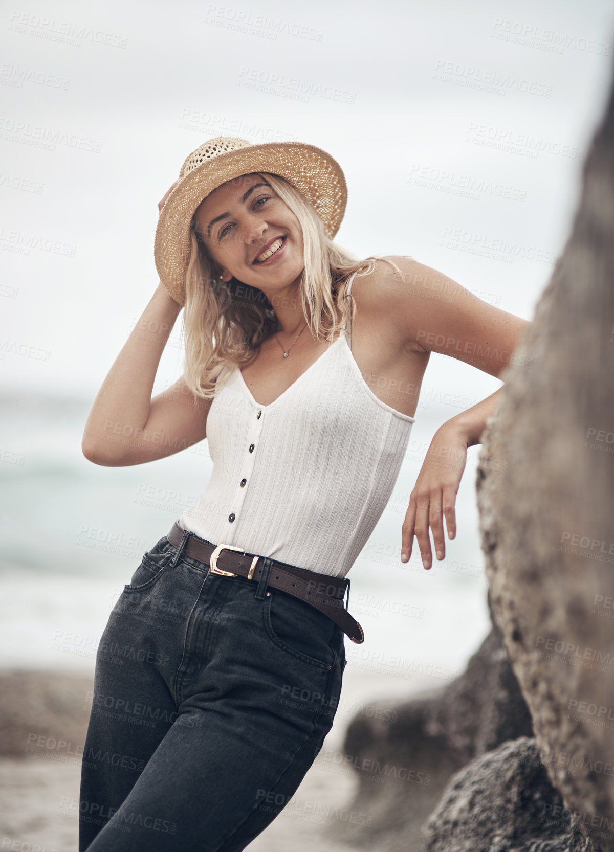 Buy stock photo Shot of a beautiful young woman spending the day at the beach