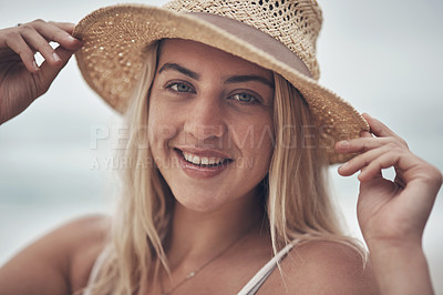 Buy stock photo Shot of a beautiful young woman spending the day at the beach