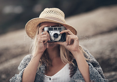 Buy stock photo Shot of a young woman out at the beach with her camera