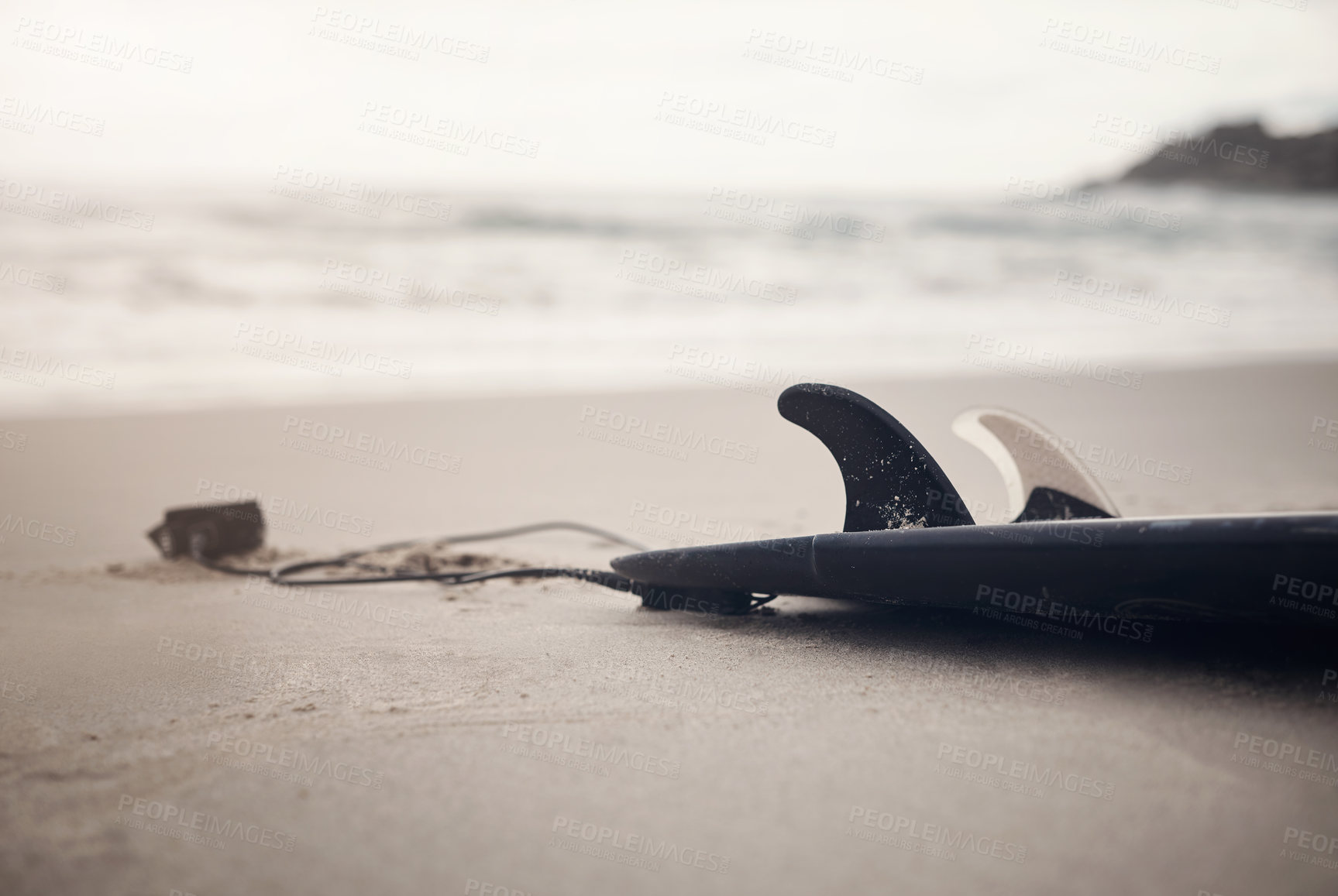 Buy stock photo Cropped shot of a surfboard on the beach