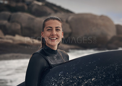 Buy stock photo Shot of a young woman out surfing at the beach