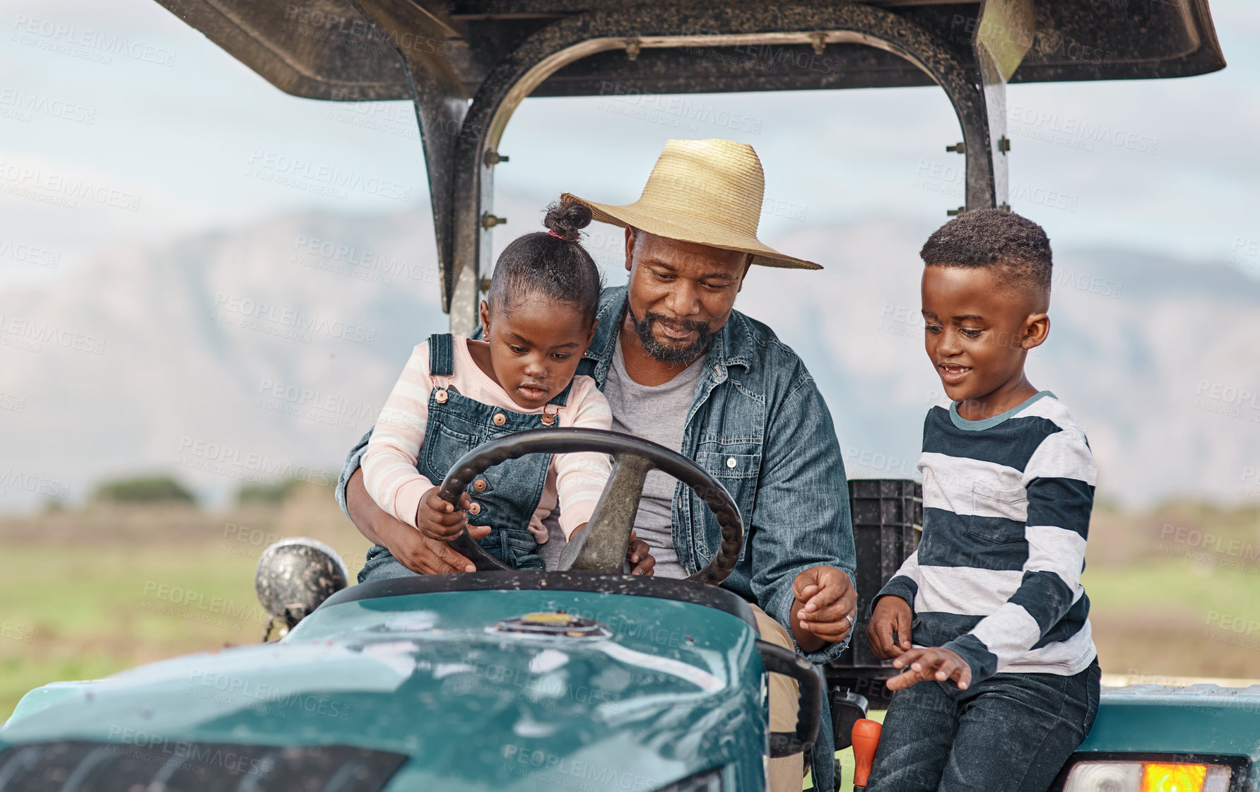 Buy stock photo Shot of a mature man driving a tractor with his adorable son and daughter on a farm