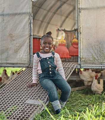 Buy stock photo Portrait of a cute little girl having fun on a chicken farm