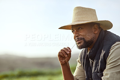 Buy stock photo Shot of a mature man working on a farm