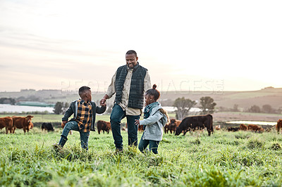 Buy stock photo Shot of an adorable brother and sister having fun with their father on a farm