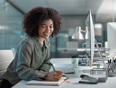 Buy stock photo Shot of a young female agent working in a call centre enjoying a moment while making notes