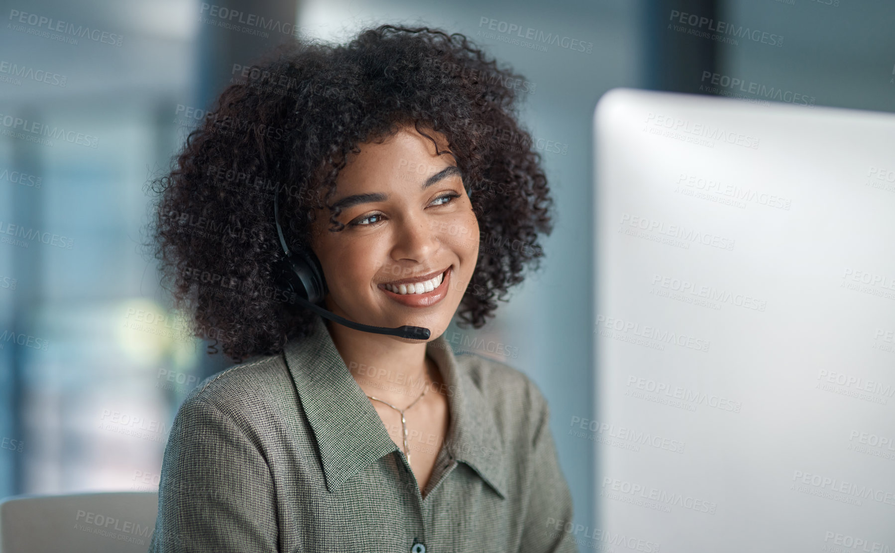 Buy stock photo Cropped shot of a young female agent smiling while working in a call centre