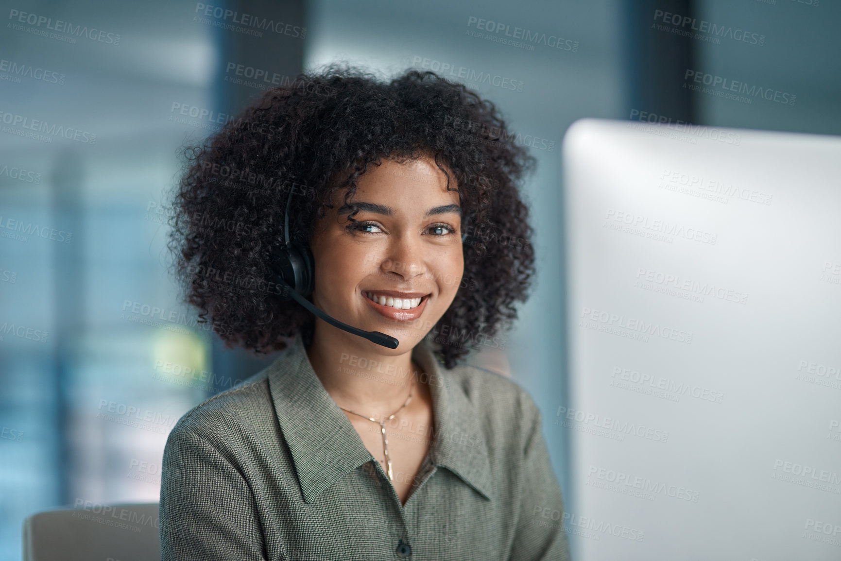 Buy stock photo Shot of a young smiling female agent working in a call centre