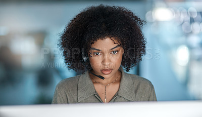 Buy stock photo Cropped shot of a young female agent listening intently to a callers problem while working in a call centre