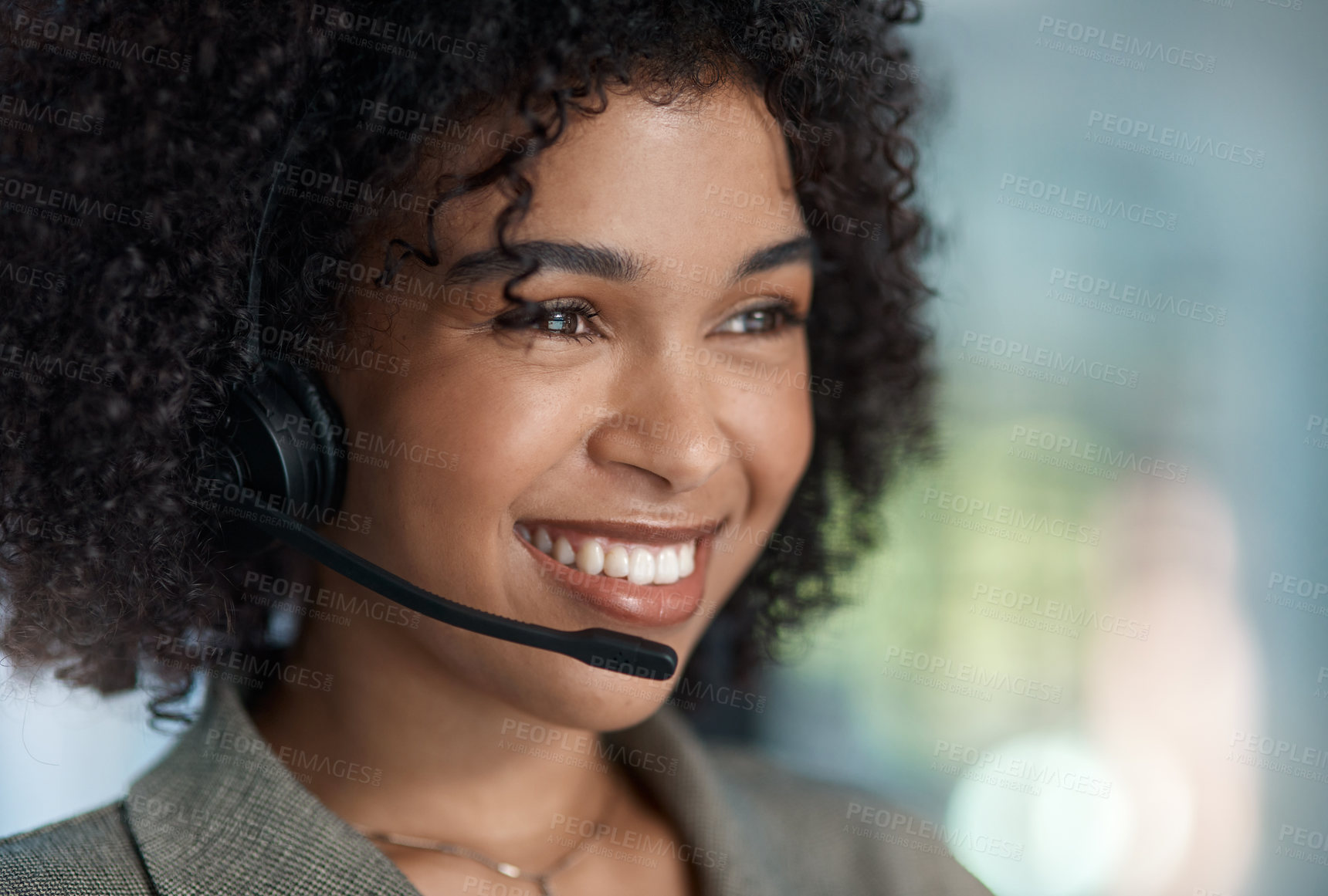 Buy stock photo Cropped shot of a young female agent smiling with her headset on while working in a call centre