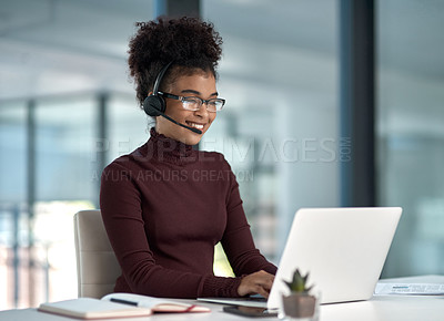 Buy stock photo Shot of a young female agent smiling while assisting on a call working in a call centre