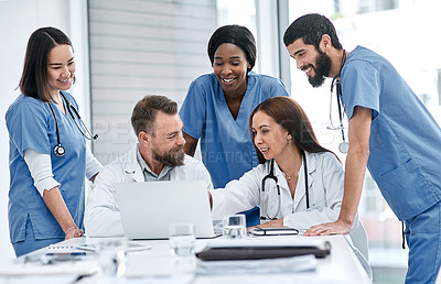 Buy stock photo Shot of a group of medical practitioners having a meeting in a hospital boardroom