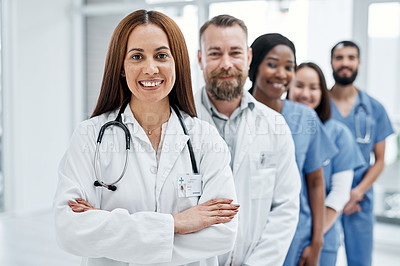 Buy stock photo Portrait of a group of medical practitioners standing together in a hospital