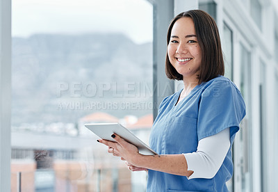 Buy stock photo Portrait of a medical practitioner using a digital tablet in a hospital